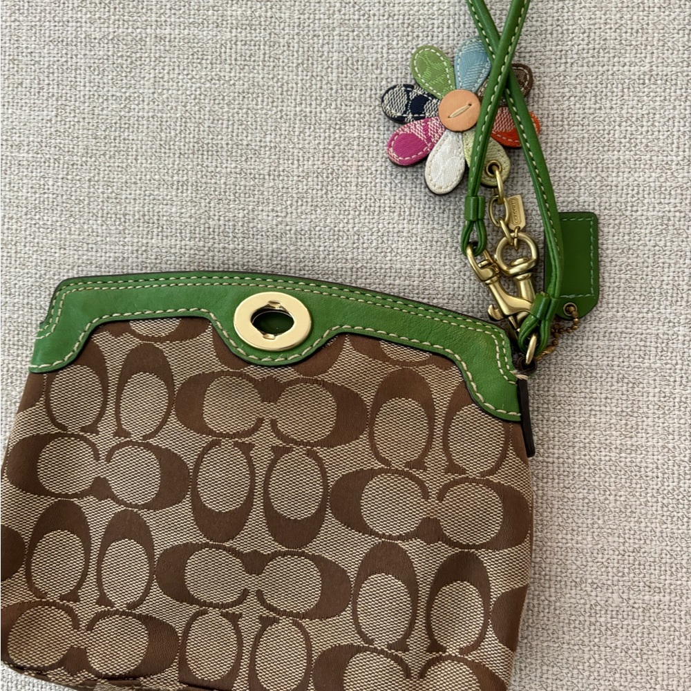 Coach wristlet with flower keychain